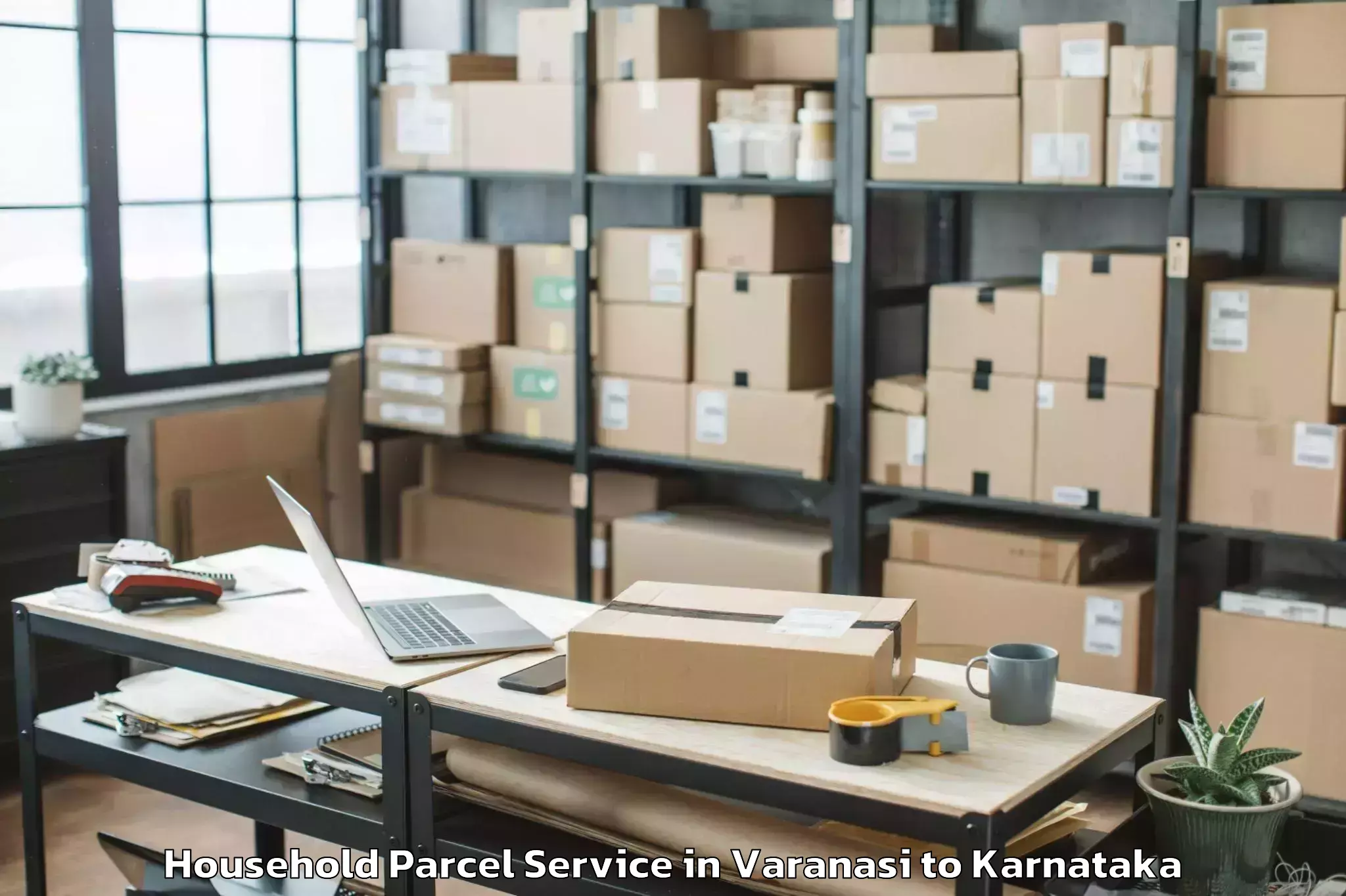 Reliable Varanasi to Karnataka State Law University Household Parcel